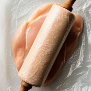 skinless chicken breasts between two sheets of plastic wrap and gently pound to an even thickness of about 1/4 inch.